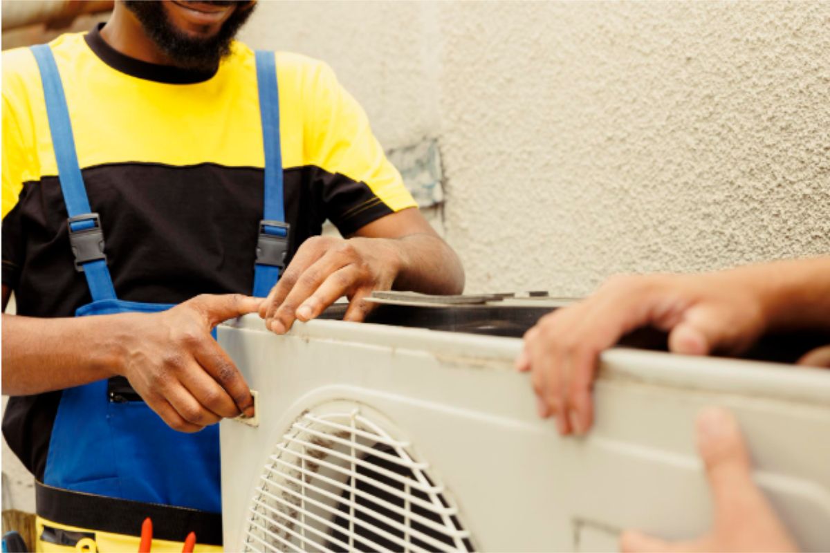 technicians-repairing-air-conditioner